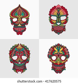 Skulls. Skull ornament. Vector illustration of decorative colored skulls on white and grey background. Masks with abstract floral pattern. Set of Day of the Dead. Good for print, graphic for tattoo. 