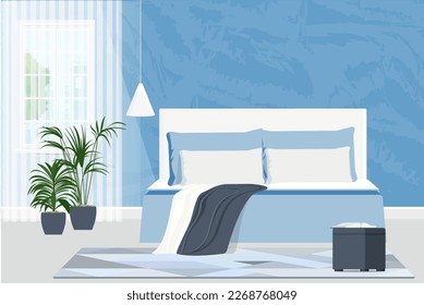 Himmelsblaues Schlafzimmer mit Doppelbett, Pflanzen und einem offenen Buch auf einem Sofa.