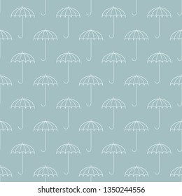 Sky blue seamless pattern with umbrellas. Open umbrella cane is repeating on sky blue background