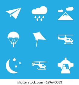 Sky icons set. set of 9 sky filled icons such as kite, luggage compartment in airplane, moon and stars, rain, helicopter, paper plane, parachute