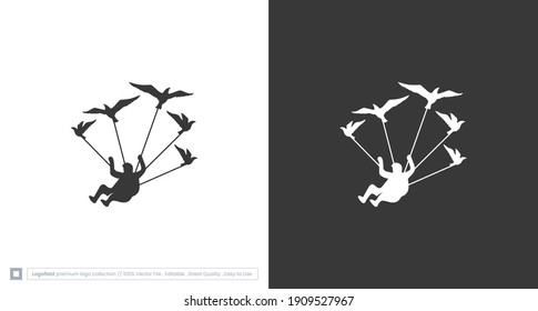 skydiver logo, the silhouette of a flying man with birds, a parachuting man with birds logo template .vector