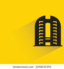 skyscraper building with shadow on yellow background