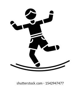 Slacklining glyph icon. Balance training. Slack rope walking. Tightrope walker. Person balancing on suspended webbing. Extreme sport. Silhouette symbol. Negative space. Vector isolated illustration