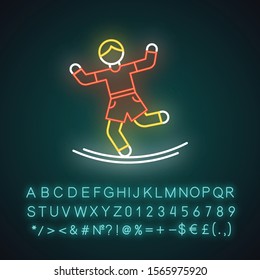 Slacklining neon light icon. Balance training. Slack rope, tightrope walking. Person balancing on suspended webbing. Glowing sign with alphabet, numbers and symbols. Vector isolated illustration