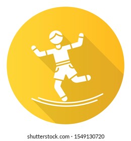 Slacklining yellow flat design long shadow glyph icon. Balance training. Slack rope walking. Tightrope walker. Person balancing on suspended webbing. Extreme sport. Vector silhouette illustration