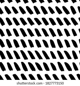 Slanted brush strokes vector seamless pattern. Chevron texture or wallpaper. Grunge geometric pattern, hand drawn vector background with diagonal dashes. Graphic brushstrokes ink illustration.