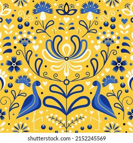 Slavic floral folk Ukraine pattern with flowers and birds. Ukrainian folkloric seamless ornament pattern in blue and yellow colors. Botanical repeating background for textiles and fabric designs.