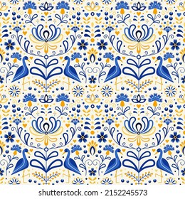 Slavic floral folk Ukraine pattern with flowers and birds. Ukrainian folkloric seamless ornament pattern in blue and yellow colors. Botanical repeating background for textiles and fabric designs.