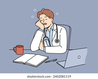 Sleeping man doctor sits at desk with computer and papers after difficult day at work. Guy doctor in white coat needs rest after long absence of vacation and overload when performing medical tasks.