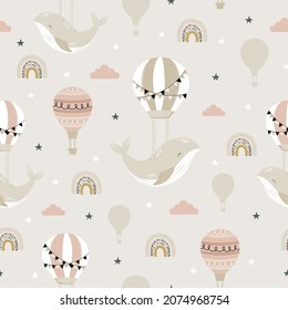 Sleeping whales, hot air ballon and rainbow seamless childish pattern. Hand drawn repeat pattern for wrapping, fabrik, textile or paper projects. Vector illustration.   