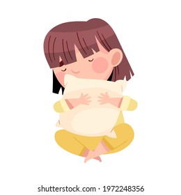 Sleepy Little Girl in Pajamas Sitting Cross Legged and Hugging Pillow Vector Illustration