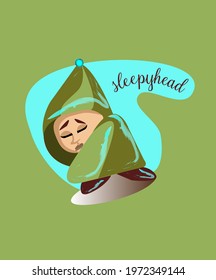 A sleepy, sad little man in a green blanket with his eyes closed.