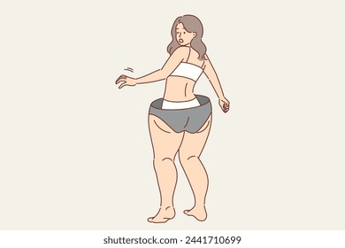 Slender girl gets scared, imagining excess weight gain and cellulite on legs and hips, screams in fear. Problem of excess weight worries thin woman, due to self-doubt or psychological problems