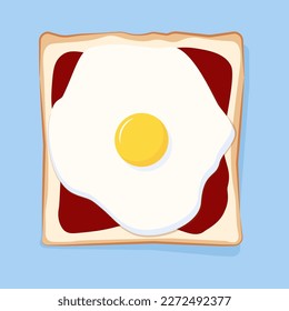 Slice of toast bread with ketchup and fried egg