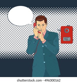 slightly worried business man makes a call to the street telephones
