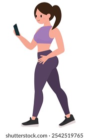 Slim fit woman looking at her cell phone in gym clothes