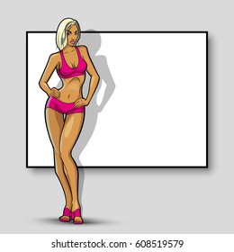 Slim girl on the background of an empty banner. Sexy woman in front of school board. Elegant lady on the background of pure advertising poster