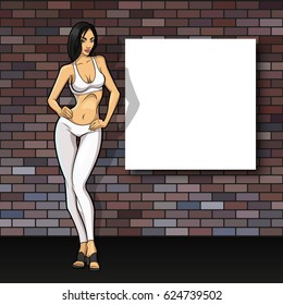 Slim girl on the background of an empty banner. Sexy woman in front of school board. Elegant lady on the background of pure advertising poster