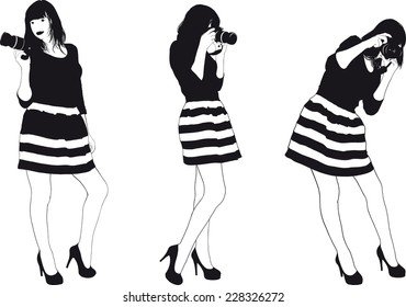 Slim pretty girl in a striped dress photographed Professional SLR camera