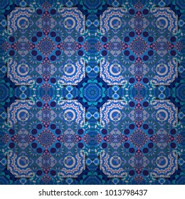 Sloping seamless colorful ornament for design and backgrounds. Kaleidoscopic orient popular style in violet, green and blue colors. Vector rich ornament.