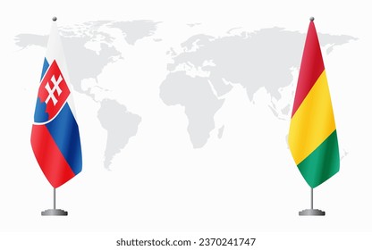 Slovakia and Guinea flags for official meeting against background of world map.