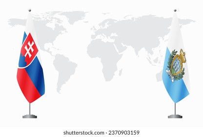 Slovakia and San Marino flags for official meeting against background of world map.