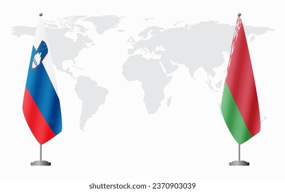Slovenia and Belarusian flags for official meeting against background of world map.