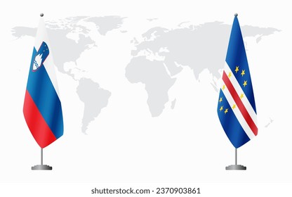 Slovenia and Cape Verde flags for official meeting against background of world map.