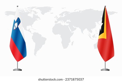 Slovenia and East Timor flags for official meeting against background of world map.