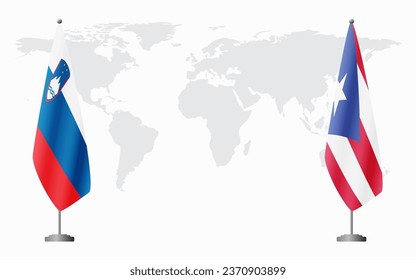 Slovenia and Puerto Rico flags for official meeting against background of world map.