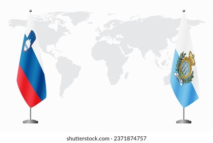 Slovenia and San Marino flags for official meeting against background of world map.