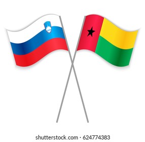 Slovenian and Bissau-Guinean crossed flags. Slovenia combined with Guinea-Bissau isolated on white. Language learning, international business or travel concept.