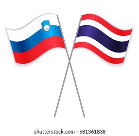Slovenian and Thai crossed flags. Slovenia combined with Thailand isolated on white. Language learning, international business or travel concept.