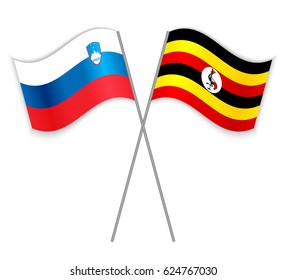 Slovenian and Ugandan crossed flags. Slovenia combined with Uganda isolated on white. Language learning, international business or travel concept.