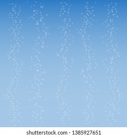 Small air bubbles on blue background. Texture for sparkling water, champagne, underwater world.