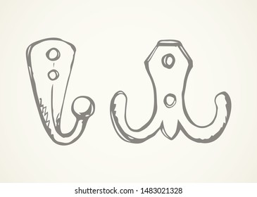 Small bath peg set design on white door backdrop. Freehand outline black ink hand drawn object logo pictogram emblem sketchy in retro art doodle style pen on paper space for text. Closeup steel holder