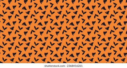 Small black bat vectors on orange background 