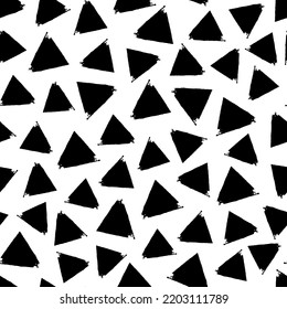 Small black ink triangles isolated on white background. Monochrome geometric seamless pattern. Vector simple flat graphic hand drawn illustration. Texture.