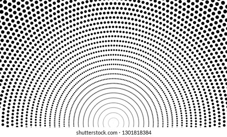 A small black spot arranged in a semi-circle on a white background