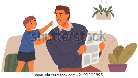 Small boy is trying to attract attention of his father, who sits on couch and reads newspaper. Child care concept, parents give little time to children. Problems of modern education and parenthood
