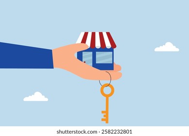Small business key to success, businessman hand hold small business shop with golden key.
