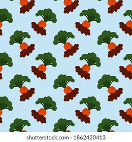 Small carrots,seamless pattern on  light blue background.
