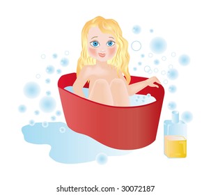 A small child bathes in red bath among soap-bubbles