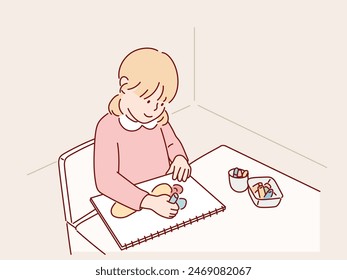 small child draws with pastel crayons on white table. Hand drawn style vector design illustrations.