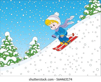 Small child skiing down the snowy hill