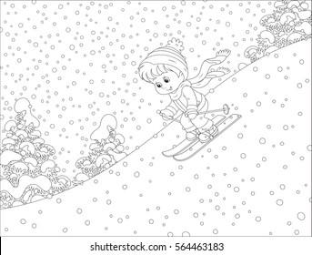 Small Child Skiing Down The Snowy Hill