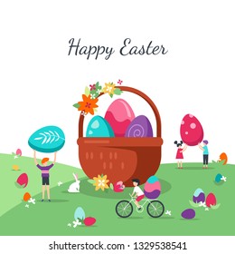 Small children lay big eggs in basket for Easter holiday