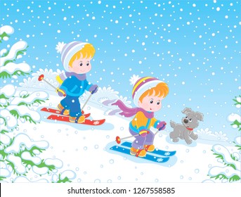 Small children skiing down a snow hill in a snow-covered winter park, vector illustration in a cartoon style