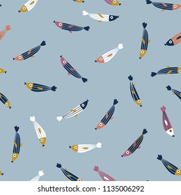 Small colorful fishes on the blue background. Abstract vector seamless pattern in flat style. Cute sea fabric design.