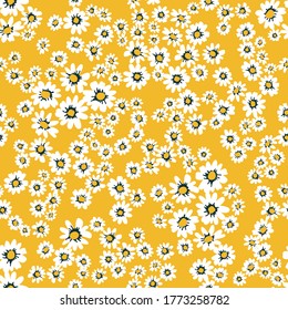 Small daisies on yellow background. Seamless pattern with cute flowers. Vintage textile collection. Template for dresses, scarves, wallpappers.